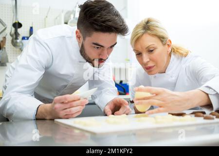 working on chocolate eggs Stock Photo