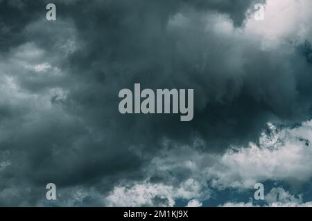 Dark Blue Cloudy Rainy Sky With Rain Heavy Clouds. Storm, Thunder, Thunderstorm, Storm clouds. Sky Natural Background. Cumulonimbus Cloud. Strange Stock Photo