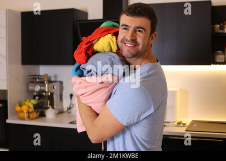 Cute man doing the laundry Stock Photo