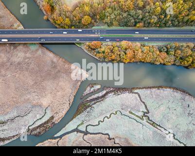 Top Down view over Marshland of River Teign shrouded in frost at morning sun from a drone, Newton Abbot, Devon, England Stock Photo