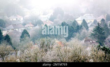 Glasgow, Scotland, UK 13th December, 2022. UK Weather:  Freezing temperatures saw a Freezing fog with visibility down to 100 metres over the white roofs in the north of the city.  Credit Gerard Ferry/Alamy Live News Stock Photo