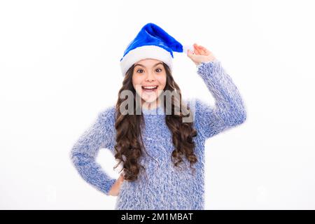 Teen girl in winter sweater on white isolated background. Portrait of teenager girl for new year and christmas banner. Stock Photo