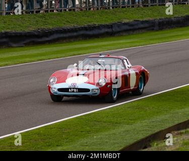 Five times Le Mans winner Derek Bell drives a Ferrari 250 GTO Scaglietti 64C 1963. APB1 / 91553 MO at the 2022 Goodwood Revival Stock Photo