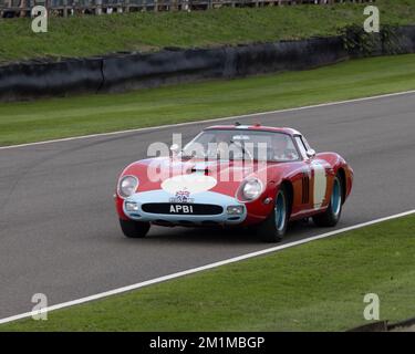 Five times Le Mans winner Derek Bell drives a Ferrari 250 GTO Scaglietti 64C 1963. APB1 / 91553 MO at the 2022 Goodwood Revival Stock Photo