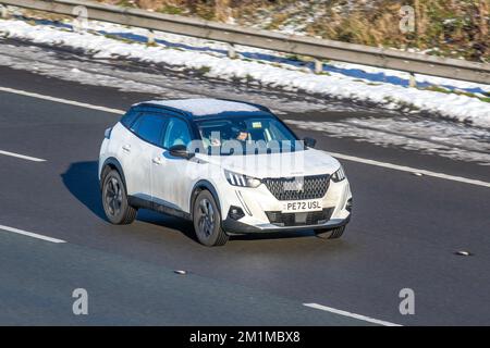 2022 White PEUGEOT GT PureTech S/S start stop; Cars travelling on a cold winter morning. Wintertime low temperatures with December frost and cold driving conditions on the M61 motorway, UK Stock Photo