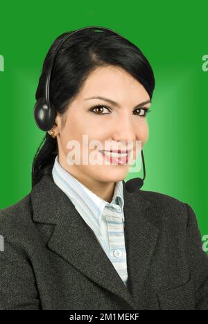 Portrait of nice costumer support operator woman smiling and ready to help you Stock Photo