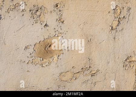 Texture of a old plaster on a cement wall destroyed by weather and time. Stock Photo