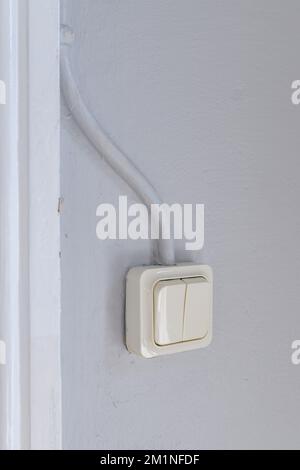 Old retro light switch in living room, selective focus Stock Photo