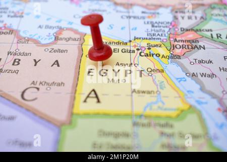 Red Push Pin Pointing on Location of Egypt World Map Close-Up View Stock Photograph Stock Photo