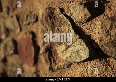 Bricks in old stone wall Stock Photo