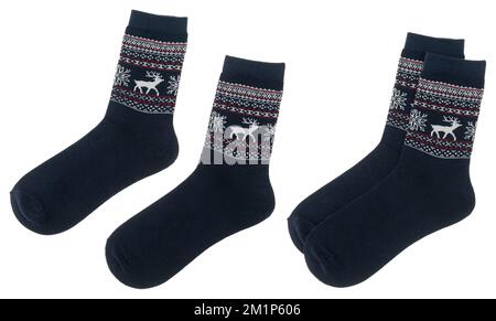 Pair of blue Nordic style socks with Norwegian knitted pattern isolated on a white background Stock Photo