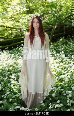 Ethereal woman in fantasy forest Stock Photo