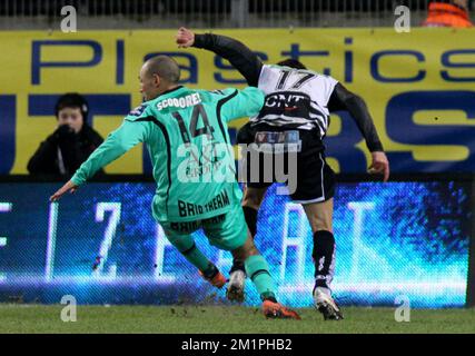 20130209 - CHARLEROI, BELGIUM: Lierse's Daylon Claasen and Charleroi's Matan Ohayon fight for the ball during the Jupiler Pro League match between Charleroi and Lierse, in Charleroi, Saturday 09 February 2013, on day 26 of the Belgian soccer championship. BELGA PHOTO VIRGINIE LEFOUR Stock Photo