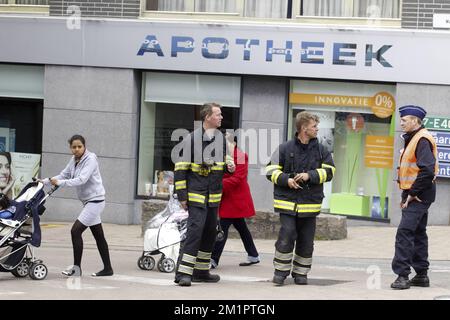 Illustration picture shows firemen in the center of Wetteren after a freight train exploded on a track near Schellebelle (part of Wichelen, Wetteren), Saturday 04 May 2013. The train exploded around 2 o clock this morning. Track exploitation company Infrabel confirmed the train contained the chemical product acrylonitrile, a toxic and inflammable fluid that can cause breathing problems. Emergency services have evacuated residents. East-Flanders governor Jan Briers just announced at a press conference 2 people died and 14 where injured. BELGA PHOTO NICOLAS MAETERLINCK Stock Photo