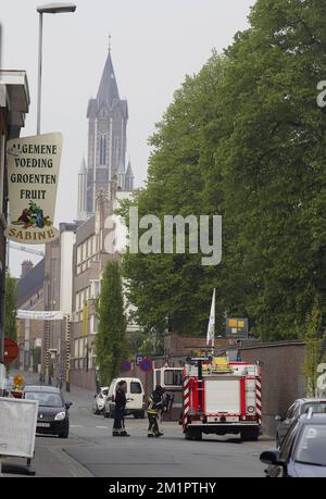 Illustration picture shows firemen in the Wegvoeringstraat in Wetteren, Tuesday 07 May 2013. On Saturday night a freight train derailed and exploded on a track near Schellebelle (part of Wichelen, Wetteren). The train contained the chemical product acrylonitrile, a toxic and inflammable fluid that can cause breathing problems. Emergency services evacuated some 500 residents. One local resident died and 49 persons were brought to hospital. BELGA PHOTO NICOLAS MAETERLINCK Stock Photo