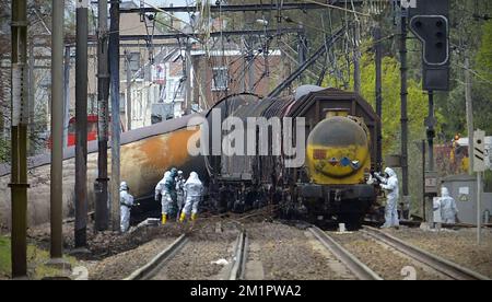 Illustration picture shows the draining of the wreck of the derailed train in Wetteren, Friday 10 May 2013. On Saturday night a freight train derailed and exploded on a track near Schellebelle (part of Wichelen, Wetteren). The train contained the chemical product acrylonitrile, a toxic and inflammable fluid that can cause breathing problems. Emergency services evacuated some 500 residents. One local resident died and 49 persons were brought to hospital.  Stock Photo