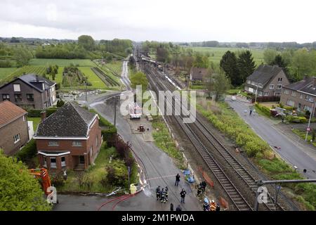 Illustration picture shows the the wrecked train from a ladder of fire brigade  in Wetteren, Saturday 11 May 2013. In the night from Friday 3 to Saturday 4 May a freight train derailed and exploded on a track near Schellebelle (part of Wichelen, Wetteren). The train contained the chemical product acrylonitrile, a toxic and inflammable fluid that can cause breathing problems. Emergency services evacuated some 2000 residents. One local resident died and in a week, 397 persons were brought to hospital, for intoxication and control. BELGA PHOTO POOL NICOLAS MAETERLINCK Stock Photo