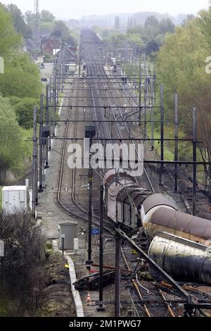 Illustration picture shows the the wrecked train from a ladder of fire brigade  in Wetteren, Saturday 11 May 2013. In the night from Friday 3 to Saturday 4 May a freight train derailed and exploded on a track near Schellebelle (part of Wichelen, Wetteren). The train contained the chemical product acrylonitrile, a toxic and inflammable fluid that can cause breathing problems. Emergency services evacuated some 2000 residents. One local resident died and in a week, 397 persons were brought to hospital, for intoxication and control. BELGA PHOTO POOL NICOLAS MAETERLINCK Stock Photo