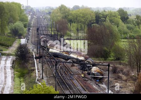 Illustration picture shows the the wrecked train from a ladder of fire brigade  in Wetteren, Saturday 11 May 2013. In the night from Friday 3 to Saturday 4 May a freight train derailed and exploded on a track near Schellebelle (part of Wichelen, Wetteren). The train contained the chemical product acrylonitrile, a toxic and inflammable fluid that can cause breathing problems. Emergency services evacuated some 2000 residents. One local resident died and in a week, 397 persons were brought to hospital, for intoxication and control. BELGA PHOTO POOL NICOLAS MAETERLINCK Stock Photo