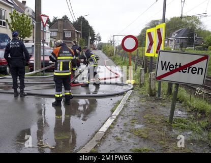 Illustration picture shows firemen in Wetteren, Saturday 11 May 2013. In the night from Friday 3 to Saturday 4 May a freight train derailed and exploded on a track near Schellebelle (part of Wichelen, Wetteren). The train contained the chemical product acrylonitrile, a toxic and inflammable fluid that can cause breathing problems. Emergency services evacuated some 2000 residents. One local resident died and in a week, 397 persons were brought to hospital, for intoxication and control.  Stock Photo