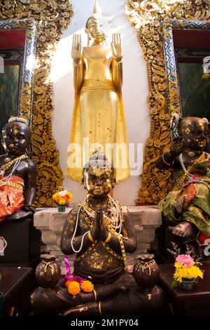 Kumara Kuman thong deity angel and buddha statue for thai people traveler travel visit respect praying bless holy mysterious mystery myth at Wat Raikh Stock Photo