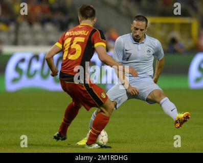 Belgium's Sebastien Pocognoli and French Franck Ribery fight for the ball during a friendly game of the Belgian national soccer team Red Devils against France's national soccer team, Wednesday 14 August 2013, in the King Baudouin Stadium (Stade Roi Baudouin/Koning Boudewijnstadion), in Brussels.  Stock Photo