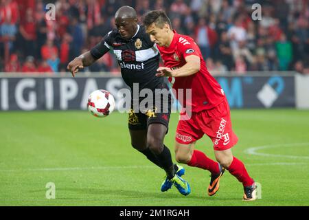 Mechelen's Benjamin Mokulu and Kortrijk's Zarko Tomasevic fight for the ball during the Jupiler Pro League match between KV Kortrijk and KV Mechelen, in Kortrijk, Saturday 24 August 2013, on day 5 of the Belgian soccer championship.  Stock Photo