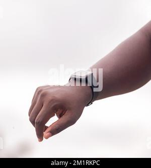 Hand of an African farmer man holding a black smartphone. Stock Photo
