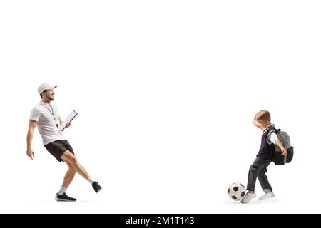 Football coach with a whistle holding a clipboard and training with a schoolboy isolated on white background Stock Photo