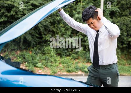 Asian businessman car broken breakdown Stock Photo