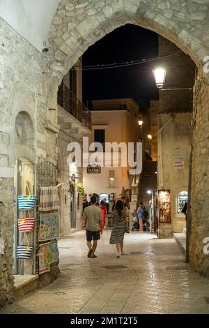 Evening shopping along the Via Duomo in the old town, Vieste, Gargano peninsula, Foggia province, Puglia, Italy, Europe Stock Photo