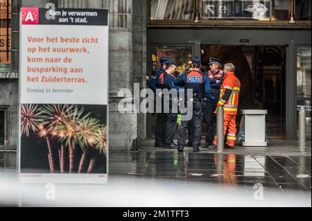 20131227 - ANTWERP, BELGIUM: Illustration picture shows police and firefighters next to a sign promoting the New Years Eve fireworks show during a bomb alert at Antwerpen-Centraal (Antwerp Central) railway station, Friday 27 December 2013, in Antwerp. BELGA PHOTO JONAS ROOSENS Stock Photo