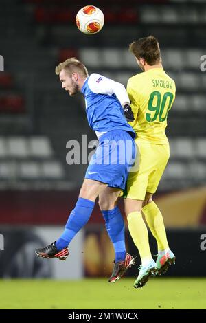 20140220 - MOSCOW, RUSSIA: Genk's Brian Hamalainen and Anzhi's Fedor Smolov fight for the ball during a soccer match between Belgian first division soccer team KRC Genk and FC Anzhi Makhachkala from Dagestan, Subject of Russia in Moscow, Russia, Thursday 20 February 2014, in the 16th finals of the Europa League tournament. BELGA PHOTO YORICK JANSENS Stock Photo