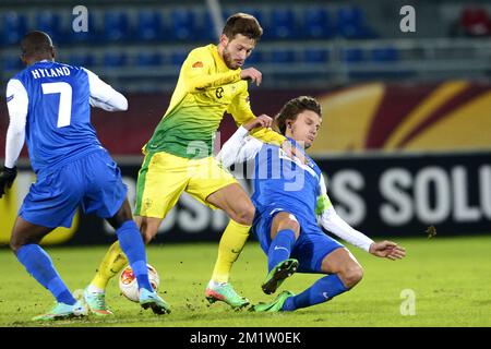 20140220 - MOSCOW, RUSSIA: Genk's Khaleem Hyland, Anzhi's Fedor Smolov and Genk's Jelle Vossen fight for the ball during a soccer match between Belgian first division soccer team KRC Genk and FC Anzhi Makhachkala from Dagestan, Subject of Russia in Moscow, Russia, Thursday 20 February 2014, in the 16th finals of the Europa League tournament. BELGA PHOTO YORICK JANSENS Stock Photo