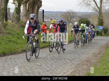 Illustration picture shows the pack of riders on the Oude Kwaremont during the 69th edition of the 'Dwars Door Vlaanderen' cycling race, 200,8 km from Roeselare to Waregem. Stock Photo