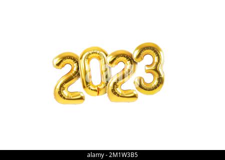 Happy new year 2023 metallic gold foil balloons on a white background. Golden helium balloons number 2023 New Year. Stock Photo