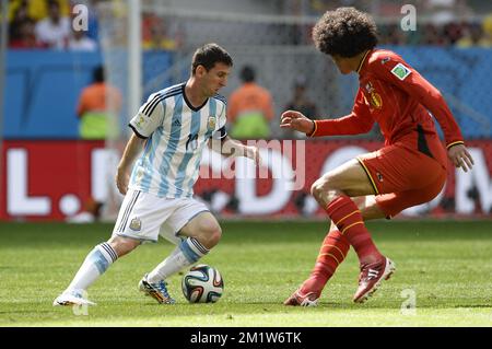 Argentina's Lionel Messi and Belgium's Marouane Fellaini fight for the ball during the quarter final match between Belgian national soccer team Red Devils and Argentina, in Estadio Nacional Mane Garrincha, in Brasilia, Brazil, during the 2014 FIFA World Cup, Saturday 05 July 2014.  BELGA PHOTO DIRK WAEM Stock Photo