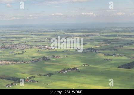 Beautiful aerial shot of Amsterdam green countryside viewed for an airplane in sunny blue day Stock Photo