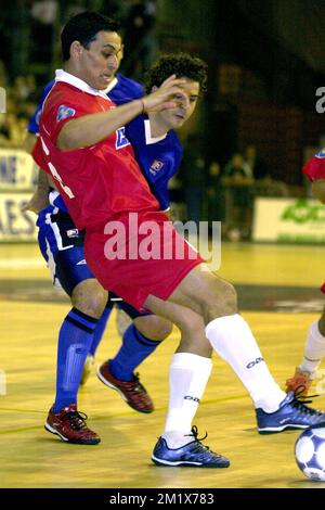 BRU162 - 20030416 - CHARLEROI, BELGIUM : Charleroi's Lucio Rosa Lima (L) chases Castellon's Santos Vander (back) during their final match of the UEFA indoor soccer champions league Action 21 Charleroi (Belgium) vs Playas de Castellon (Spain), Wednesday 16 April 2003, in Charleroi. BELGA PHOTO VIRGINIE LEFOUR Stock Photo