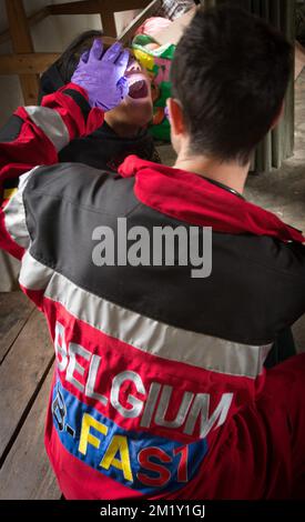 20150430 - GORKHA, NEPAL: A member of the B-Fast team helps local people, an emergency aid mission of the Belgian B-Fast disaster aid team in Gorkha (140 km away from Kathmandu), Nepal, Thursday 30 April 2015. Nepal was hit Saturday 25 April by an earthquake causing massive damage in the capital Kathmandu and avalanches at the Everest base camp. More than 5000 people are confirmed to have died. BELGA PHOTO BENOIT DOPPAGNE Stock Photo