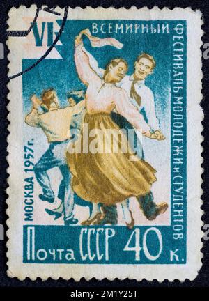 USSR - CIRCA 1957: Postage stamp 40 kopeck printed in the Soviet Union shows several young couples dancing. Post stamp series devoted to 6th World Fes Stock Photo