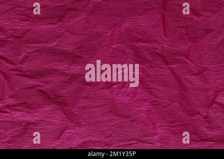 Craft Paper Texture or Background in bright magenta color. Close-up. Stock Photo