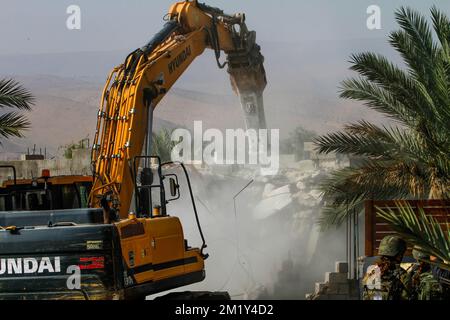 December 13, 2022, Jordan Valley, West bank, Palestine: Israeli army bulldozer on duty during the demolition of Palestinian homes in the northern Jordan Valley in the occupied West Bank. Israeli army bulldozer demolished Palestinian houses and homes to deport them from it because it's a border area between the land inhabited by Palestinians and the land was seized by the Israeli authorities. (Credit Image: © Nasser Ishtayeh/SOPA Images via ZUMA Press Wire) Stock Photo