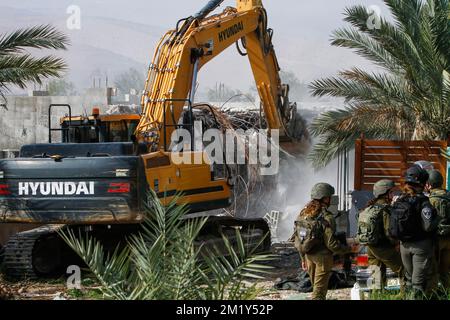 December 13, 2022, Jordan Valley, West bank, Palestine: Israeli army bulldozer on duty during the demolition of Palestinian homes in the northern Jordan Valley in the occupied West Bank. Israeli army bulldozer demolished Palestinian houses and homes to deport them from it because it's a border area between the land inhabited by Palestinians and the land was seized by the Israeli authorities. (Credit Image: © Nasser Ishtayeh/SOPA Images via ZUMA Press Wire) Stock Photo