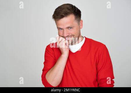 Shy handsome adult male looking at camera  Stock Photo
