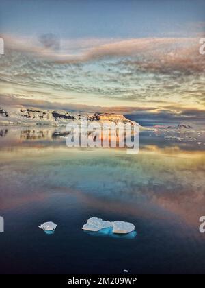 beatiful view of sunset in antarctica,antarctica landscape,atntactic sunset,antartica sunset,sunset,antarctica,antarctica iceberg,antarctica glacier Stock Photo