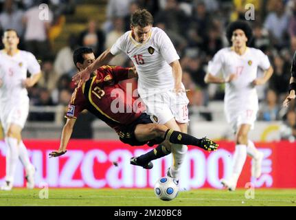 20090905 - LA CORUNA, SPAIN: (L-R) Spain's Sergio Busquets and Belgium's Jan Vertonghen fight for the ball during the qualification match Spain vs Belgium, for the South Africa 2010 Soccer World Championships, Saturday 05 September 2009, at the Riazor stadium in La Coruna, Spain.  Stock Photo
