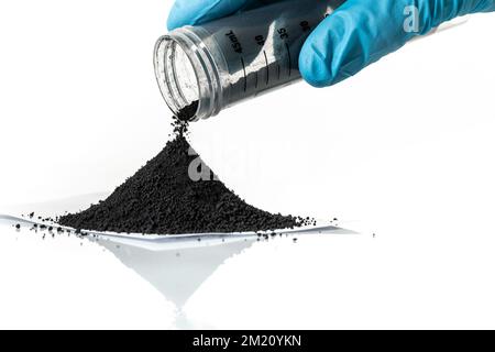 Iron nanoparticles in a lab, on a white glossy surface Stock Photo