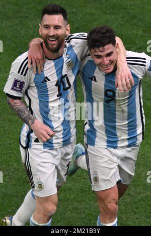 Lusail, Qatar. 13th Dec, 2022. Soccer, World Cup, Argentina - Croatia, final round, semifinal, Lusail Stadium, Argentina's Julian Alvarez celebrates with Argentina's Lionel Messi after scoring to make it 0-2. Credit: Robert Michael/dpa/Alamy Live News Stock Photo