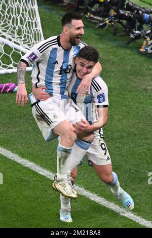 Lusail, Qatar. 13th Dec, 2022. Soccer, World Cup, Argentina - Croatia, final round, semifinal, Lusail Stadium, Argentina's Julian Alvarez celebrates with Argentina's Lionel Messi after scoring to make it 0-2. Credit: Robert Michael/dpa/Alamy Live News Stock Photo